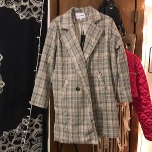 Fashion nova size large tweed coat never been worn. Too big for me